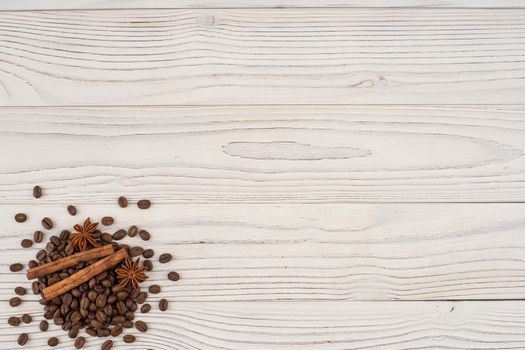 Coffee with cinnamon on old wooden table. Top view.