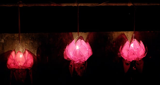 Red lantern with light from candle hang on the wall at night in mid autumn festival, a traditional culture of Viet Nam