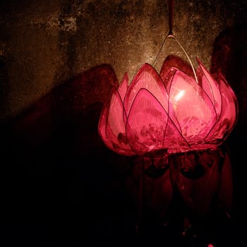 Red lantern with light from candle hang on the wall at night in mid autumn festival, a traditional culture of Viet Nam