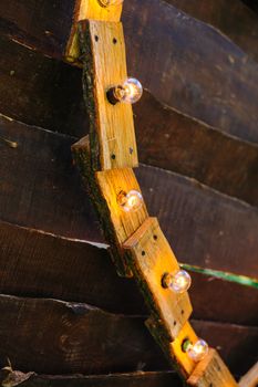 decor of the included bulbs garlands on a wooden background.