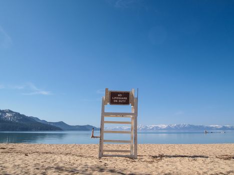 lifeguard chair stand on the shore of lake Tahoe. 