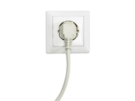 White socket outlet European standard with connected white power cable with corresponding AC power plug closeup on a light background
