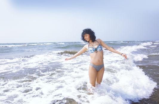 Happy woman at Atlantic ocean