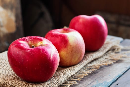 Fresh apple on old wooden table.