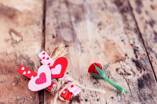 Hearts and roses on the old wooden floor.