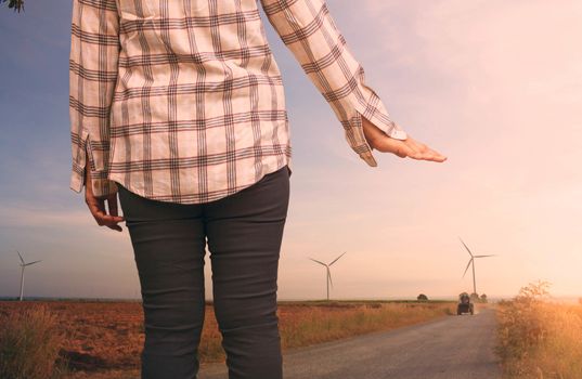 woman tourist hitchhiking on a country road.