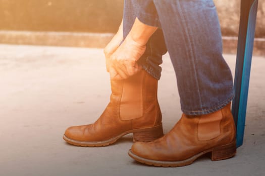 Woman with shoes that are worn on the ground.