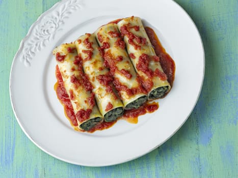 close up of rustic italian vegetarian spinach cannelloni pasta