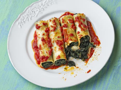 close up of rustic italian vegetarian spinach cannelloni pasta