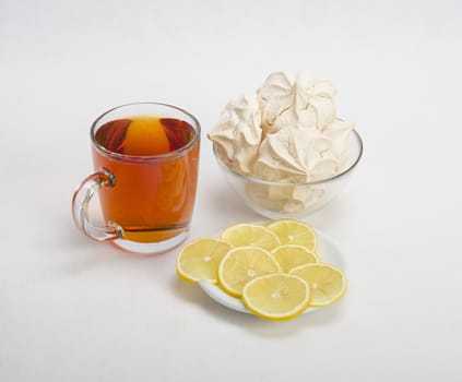 Fresh delicious meringue cookies served with tea or coffee macro