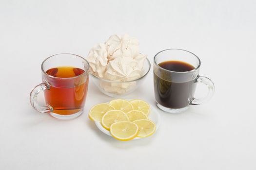 Fresh delicious meringue cookies served with tea or coffee macro