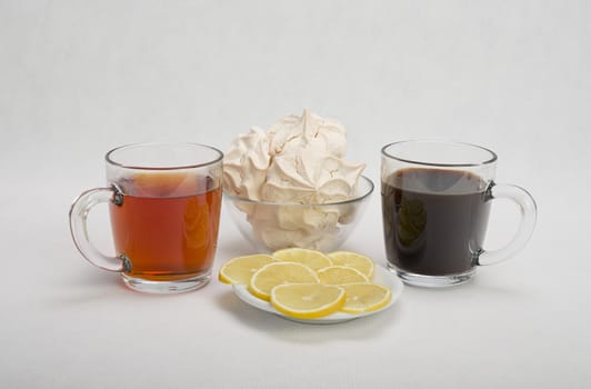 Fresh delicious meringue cookies served with tea or coffee macro