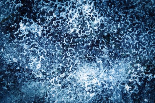 abstract background or texture a frozen water puddle