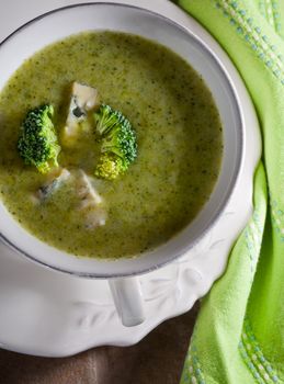 A bowl of creamy broccoli soup with blue cheese
