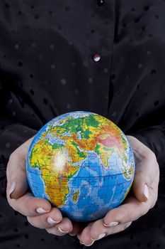Earth globe in hands protected. Ideal for Earth protection concepts, recycling, world issues, enviroment themes