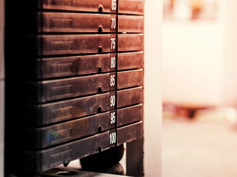 Stack of rusty metal weights in gym bodybuilding equipment. Bodybuilding concept. Hign contrast and monochrome color tone