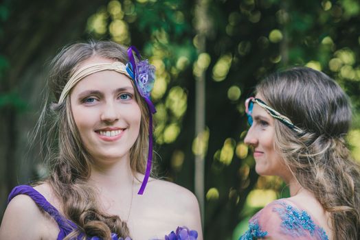 Portrait of two sisters twins in summer