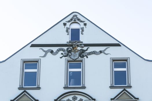 Old house facade with various stucco decorations
