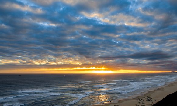 Beautiful sunset on the ocean at the coast of South Africa