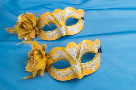 Carnival masks on blue background.