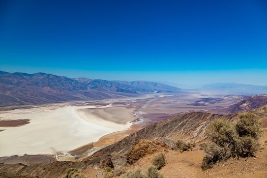 Dante's View is a viewpoint terrace at 1,669 m (5,476 ft) height, on the north side of Coffin Peak, along the crest of the Black Mountains, overlooking Death Valley. Dante's View is about 25 km (16 mi) south of Furnace Creek in Death Valley National Park.