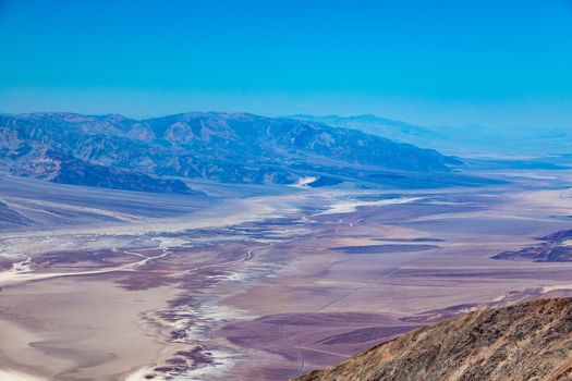 Dante's View is a viewpoint terrace at 1,669 m (5,476 ft) height, on the north side of Coffin Peak, along the crest of the Black Mountains, overlooking Death Valley. Dante's View is about 25 km (16 mi) south of Furnace Creek in Death Valley National Park.