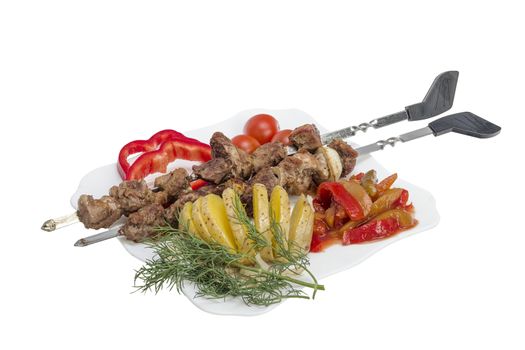 Kebabs grilled meat tomatoes and vegetables on white background 