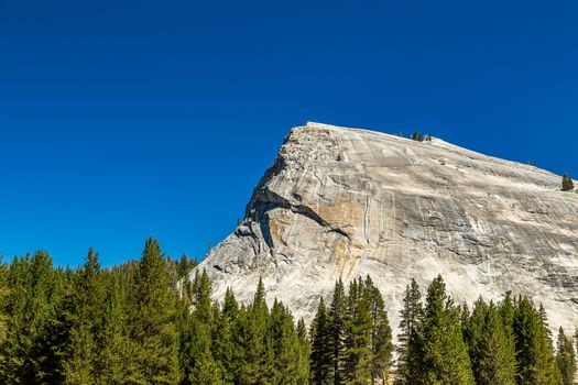 Lembert Dome is a granite dome rock formation in Yosemite National Park in the US state of California. The dome soars 800 feet (240 m) above Tuolumne Meadows and the Tuolumne River and can be hiked starting at the Tioga Road in the heart of Tuolumne Meadows, 8 miles (13 km) west of the Tioga Pass Entrance to Yosemite National Park.