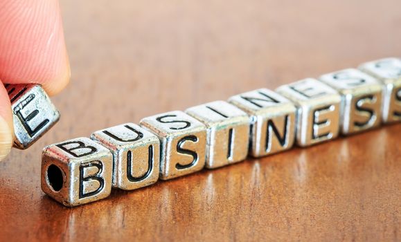 e-business letters placed on a desk in precious wood