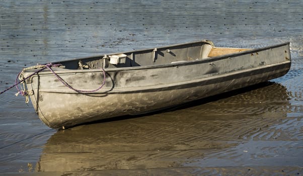 Tied old fishing boat. Moored fishing boat floating on the North Atlantic Ocean, Maine, USA.