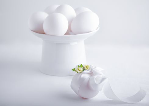 Eggs with flowers on a white background. Easter Symbols.