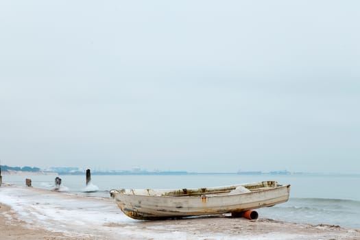 Boat on the shore of the Baltic Sea in winter