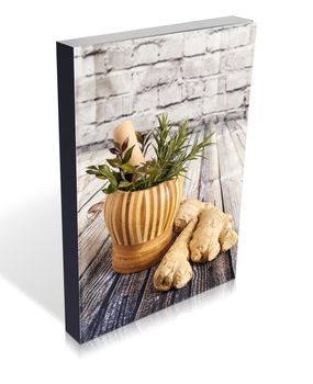 book of Ginger and herbs on a wooden board