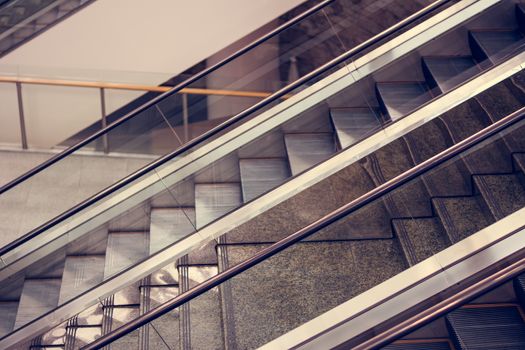 Modern escalator in shopping mall tone vintage