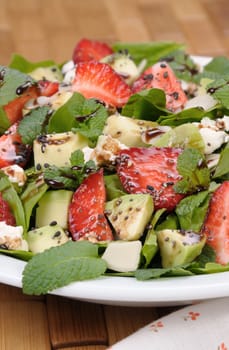 Salad spinach with strawberries, avocado, mint, ricotta and sesame,poppy seeds 