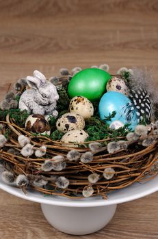 Easter colored eggs scattered on a green moss as an element of a holiday decoration ideas