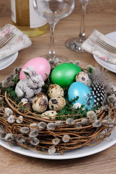 Easter colored eggs scattered on a green moss as an element of a holiday decoration ideas