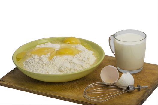 blank pancakes broken egg in wheat flour and whisk for whipping