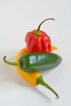 Sweet and Hot Peppers on white background