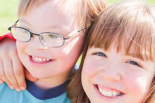 Cute Little Boy With Downs Syndrome With Sister