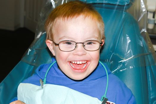 Cute Young Boy With Downs Syndrome at the Dentist