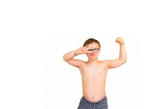 Young Boy With Downs Syndrome Flexing His Muscles