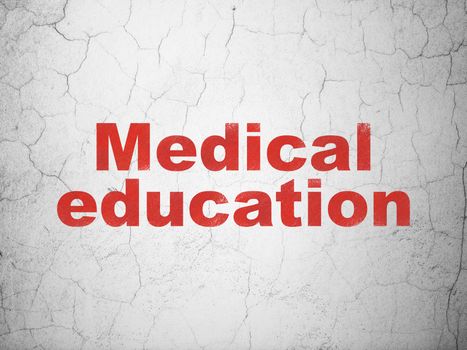 Education concept: Red Medical Education on textured concrete wall background