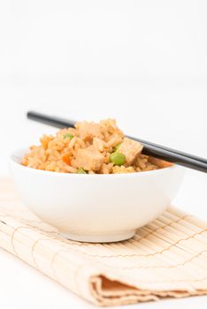 Bowl of chicken fried rice photographed closeup.