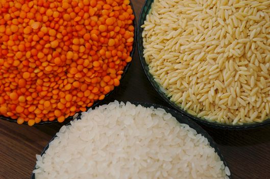 glass bowl of rice, red lentils and barley noodles