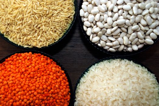 in a glass bowl of rice, red lentils, haricot beans and barley noodles