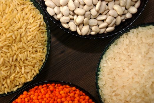 in a glass bowl of rice, red lentils, haricot beans and barley noodles