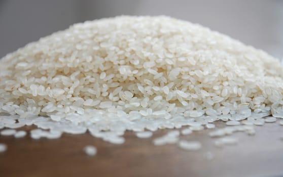 Delicious white rice grains on the table close-up background image
