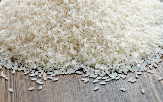 Delicious white rice grains on the table close-up background image