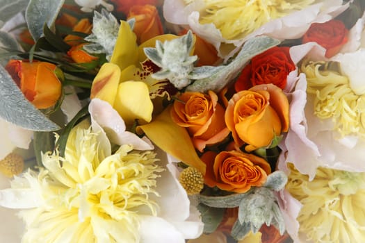 Wedding bouquet of roses, orchids and peonies
